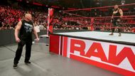 Lesnar circles the ring...